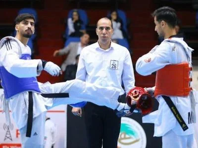 داور قمی تکواندو در مسابقات جهانی قضاوت می کند